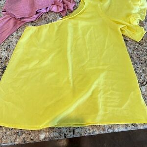 One shoulder sunshine yellow top. Worn once. Like new.
